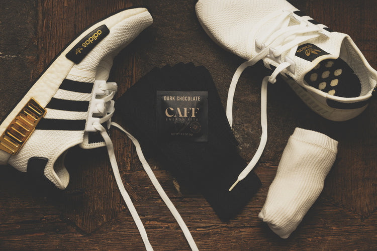 A Dark Chocolate CAFF bite with white sneakers and socks